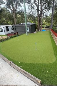 Backyard Golf Install above retaining wall